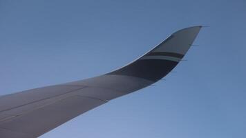 Close-up shot for the flying airplane, the trailing edge of the wing video