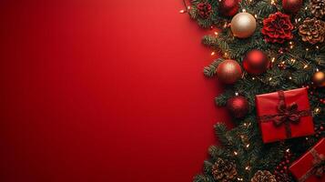 Christmas tree with ornaments and presents on a vibrant red background with space for text photo