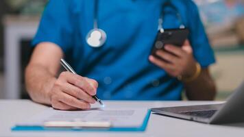 Nurse using phones at home concept. Healthcare professional records notes while using smartphone in clinical setting, highlighting integration of technology in modern medical practice and patient care photo