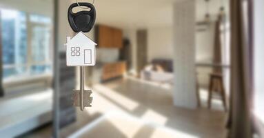 Open door with keys, key in keyhole photo