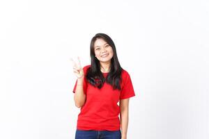 Smiling and showing counting finger, Two Finger Of Beautiful Asian Woman wearing red Isolated On White Background photo