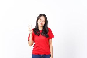 Smiling and showing counting finger, Three Finger Of Beautiful Asian Woman wearing red Isolated On White Background photo