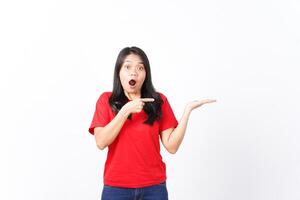 Showing and Presenting on Open Palm with WOW and Shocked Expression Of Beautiful Asian Woman wearing red Isolated On White Background photo