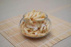 telur gabus sticks in a jar on wooden table photo