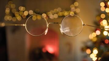 POV Glasses Of Santa Claus Point Of View In Front Of Christmas Tree photo