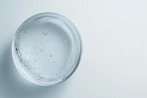 Transparent gel with bubbles in glass bowl photo