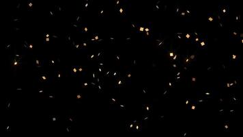 Golden confetti burst - confetti explodes from the bottom of the frame then double pops and falls glittering to the ground. Festive celebration concept. Overlay with transparent alpha channel. video
