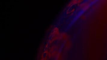 Red purple liquid sphere in macro, connection of bubbles in macro, dark background video