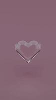A heart shaped object floating in the air on a purple background video