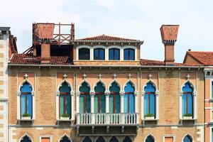 Venetian Architecture Featuring Windows and Elegant Balcony photo