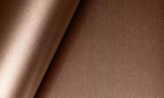 Soft mocha mousse tone on a textured paper backdrop photo