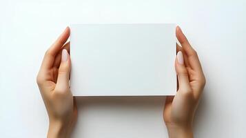 hands holding blank paper isolated on white background with shadow. Human hands gently holding a clean, white sheet of paper, perfect for mockups, presentations, and creative designs photo