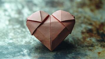 Paper origami heart on bokeh background. Love concept. photo