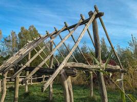 The Wooden house. Artwork of a frame of a house, made of branches. photo