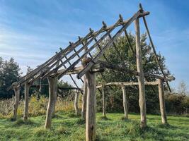 The Wooden house. Artwork of a frame of a house, made of branches. photo