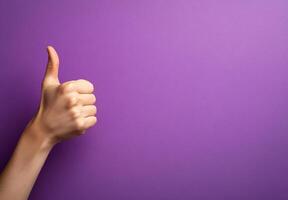 Positive gesture of approval on a vibrant purple backdrop symbolizes satisfaction and encouragement for reviews and feedback in creative designs photo
