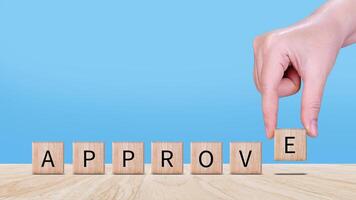 Approve guarantee concept, Approved on wooden cube, accept, pass inspection, approve document and project, Management, examine, business, survey, certification. photo