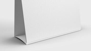 white paper desk calendar on white background for mockup photo