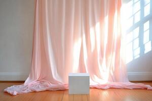 A minimalist setup featuring a white cube against a draped backdrop. photo