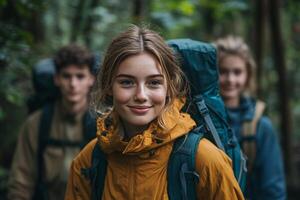 Group of hikers in forest with backpacks, smiling and enjoying nature. photo