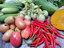 Photo of a pile of various vegetables on a table