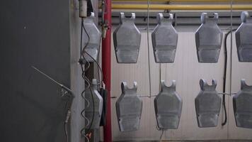 A bunch of metal chairs hanging from the ceiling video
