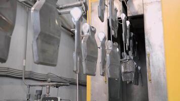 A large room with many metal objects hanging from the ceiling video