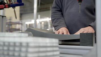 A man working on a machine in a factory video