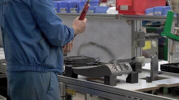 A man working on a machine in a factory video