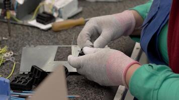 A person working on a computer with gloves on video