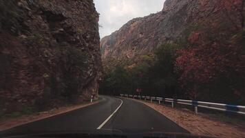 Stock 4K Point of View Hyperlapse Time-lapse of car driving pass canyon open mountain area on Both Sides High Speed On The Open Road. FAst Hyperlapse Road Trip Travel Concept Sort of Dashcam POV video
