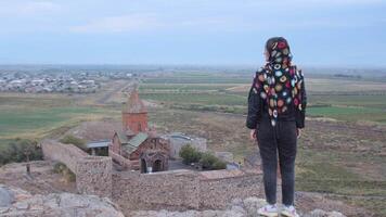 Happy tourist blogger on viewpoint by famous Khor Virap monastery.Khor Virap is an Armenian monastery located in the Ararat Plain in Armenia. Ararat Province, within the territory of ancient Artaxata video
