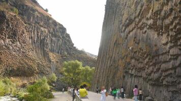 Garni, Armenia - 15th october, 2024- visitors sightseeing popular travel destination in armenia - Basalt columns in Garni Gorge. Symphony of Stones. Geological formation of octagonal basalt columns video