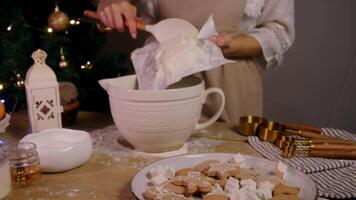 Young baker places large block of butter in mixing bowl in order to combine ingredients for their Christmas baking and ginger cookies. video