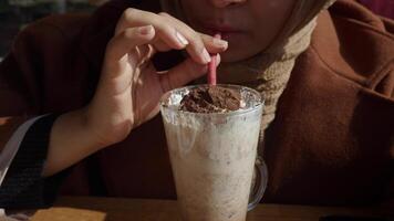 Savoring a delicious Chocolate Milkshake topped with Whipped Cream video