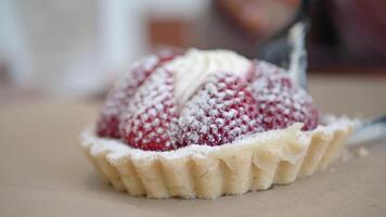Indulge in a Delicious Strawberry Tart topped with Cream and Icing Sugar video