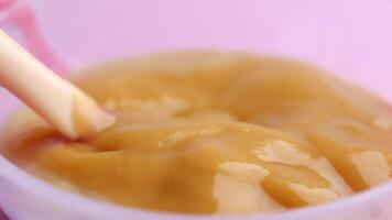 baby food in a container on table with copy space. video