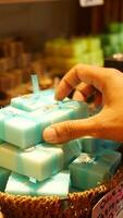 Discover beautiful handmade organic soap bars presented in a wicker basket with colorful fabrics video