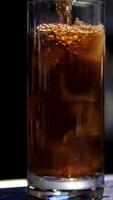 Fresh Cola Being Poured In To The Glass With Ice Cubes On Background video