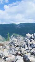 A view of the mountains from a rocky area video