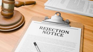 Wooden Lawyer Desk with Highlighted Word 'REJECTION NOTICE' on Clipboards Documents on Table. Judge's Wooden Gavel Knocking and Court Making Decision on 'REJECTION NOTICE' in Courtroom. video
