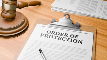 Wooden Lawyer Desk with Highlighted Word 'ORDER OF PROTECTION' on Clipboards Documents on Table. Judge's Wooden Gavel Knocking and Court Making Decision on 'ORDER OF PROTECTION' in Courtroom. video