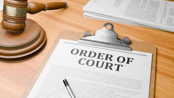 Wooden Lawyer Desk with Highlighted Word 'ORDER OF COURT' on Clipboards Documents on Table. Judge's Wooden Gavel Knocking and Court Making Decision on 'ORDER OF COURT' in Courtroom. video