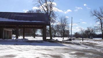 A large building with snow on the ground and trees video