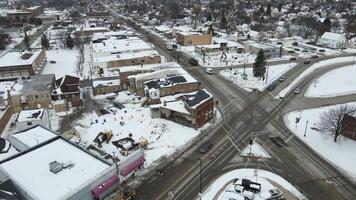 An aerial view of a city intersection with snow on the ground video