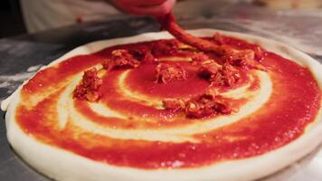 Adding Spicy Calabrian Nduja On Pizza With Tomato Sauce video