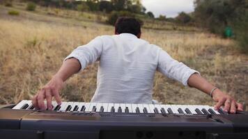 Man Plays The Keyboard Backwards In The Nature video
