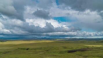 Time lapse of rain clouds moving over mountains and plain in Iceland. video