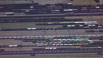Aerial view of Railway sorting station and A lot of wagons at a railway. Drone flies over railway tracks. 4k quality video