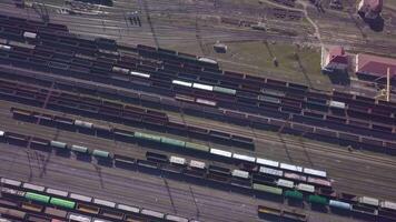 Aerial view of Railway sorting station and A lot of wagons at a railway. Drone flies over railway tracks. 4k quality video